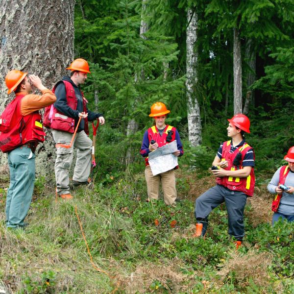 Students posing with field gear